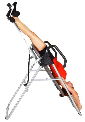 Benefits-Of-Inversion-Table-For-Back-Pain-with-women-wearing-red-are-turned-over-with-his-head-under-the-body